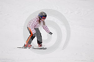 Little girl learning alpine skiing