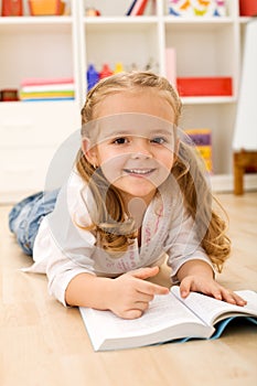 Little girl learning to read