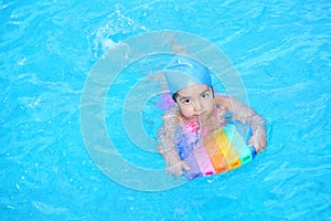 Little girl learning to swim