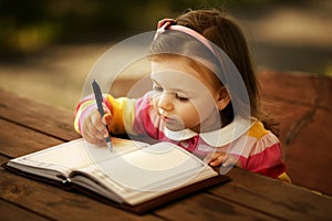 Little girl learning to write