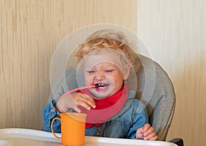 Little girl learns to eat alone