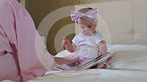 Little girl learns to read with mom