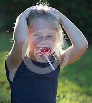Little girl with lollipop candy