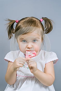 Little girl with lollipop