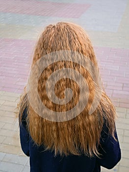 Little girl with long flowing wavy blond hair