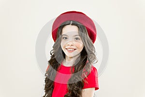 Little girl with long hair. Kid happy cute face adorable curly hair yellow background. Lucky and beautiful. Beauty tips