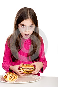 Little girl looking hamburger