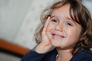 little girl looking to the side with fanny face