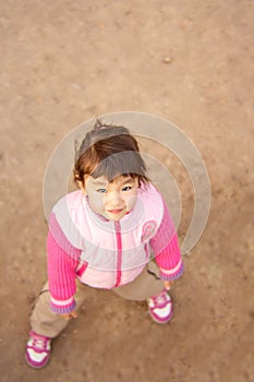 Little girl looking up