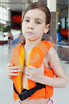 Little girl looks at camera after swimming