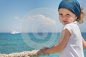 Little girl looks out to sea.