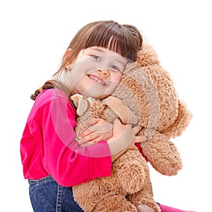 Little girl loving her plush bear