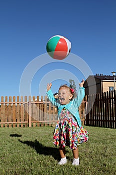 Little girl lti-colored ball