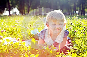 Little girl lying on the grass