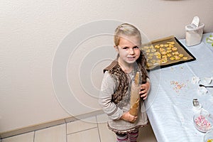Little girl make cookies
