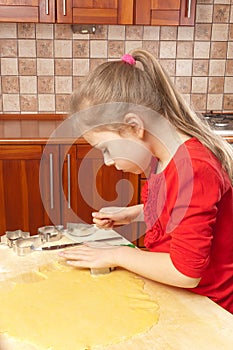 Little girl makes cookies