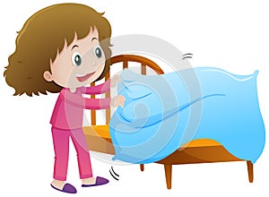 Little girl making bed