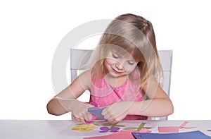 Little girl making a crafts.