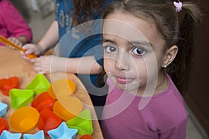 little girl making faces