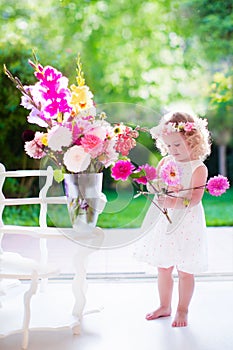 Little girl making flower arrangement