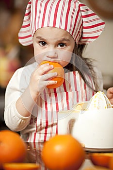 Little girl making fresh juice