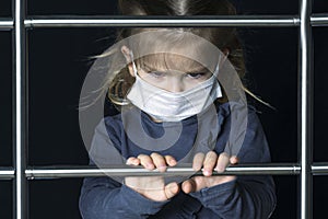 A little girl in a mask climbs the stairs. moving up to success