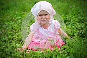 Little girl on meadow