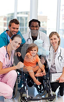 Little girl with medical team