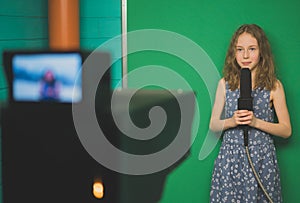 Little girl with microphone.