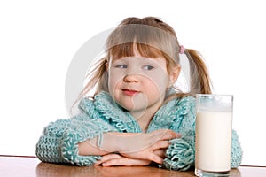 The little girl with a milk glass