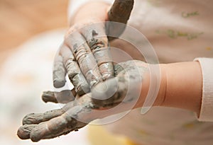 Little girl modelling clay toy