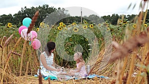 Little Girl with Mom Have Rest Together in Picnic