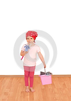 Little girl with mop, broom and bucket ready for spring cleaning isolated