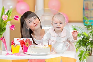 Little girl and mother celebrate birthday