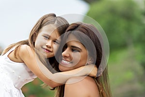 Little girl with mother in park