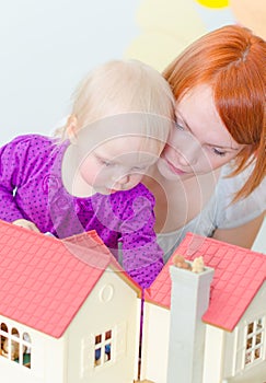 Little girl and mother playing.