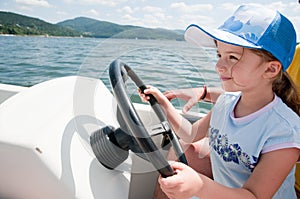 Little girl on motorboat