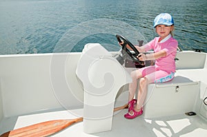 Little girl on motorboat