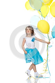 Little girl with multicolored balloons.