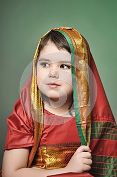 A little girl is in the national Indian dress