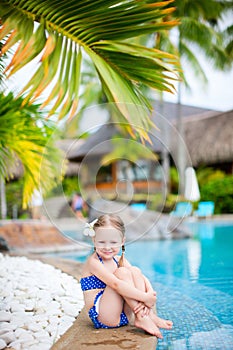 Little girl near swimming pool