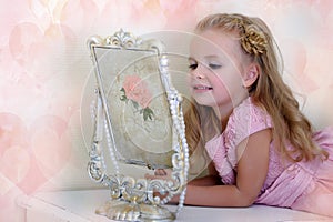 The little girl next to a mirror