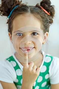 Little girl with no tooth. The child lost a tooth.