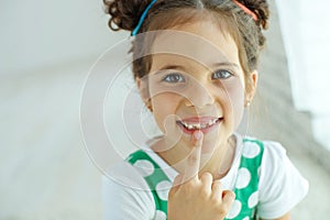 Little girl with no tooth. The child lost a tooth.