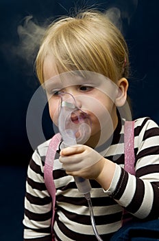 Girl with inhalator photo