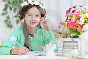 Little girl with notepad