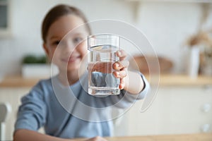 Little girl offer clean mineral water for body refreshment