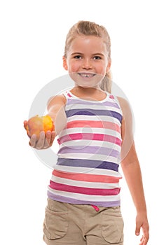 Little girl offers a nectarine