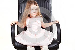 Little girl on office chair