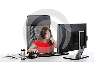 Little girl in the office of the table